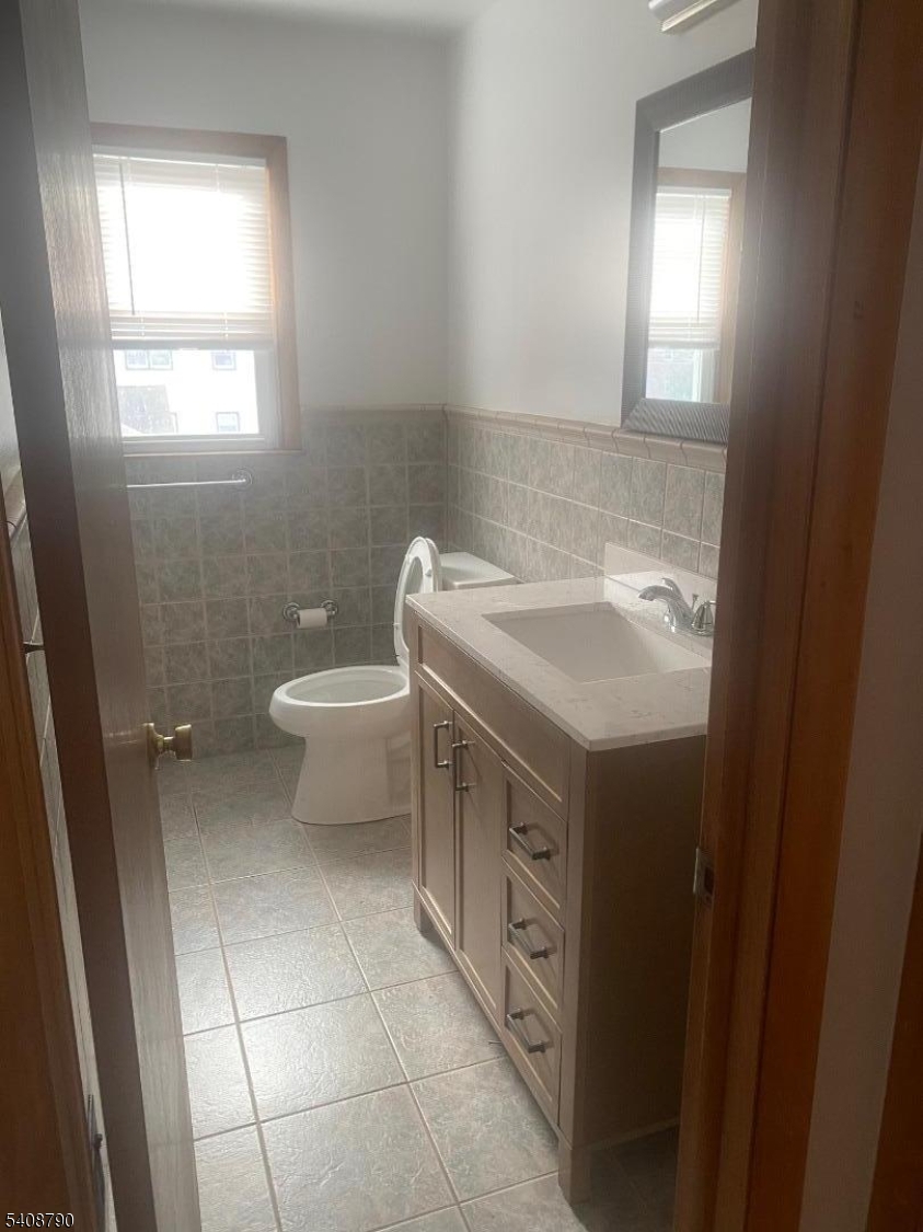 423 Clarkson Avenue, Unit 2 Elizabeth, NJ 07202 - Photo 6 of 16 a bathroom with a sink toilet and window