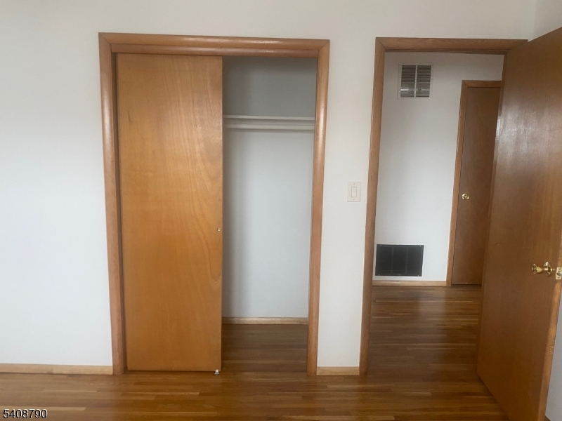 423 Clarkson Avenue, Unit 2 Elizabeth, NJ 07202 - Photo 10 of 16 a view of empty room with wooden floor
