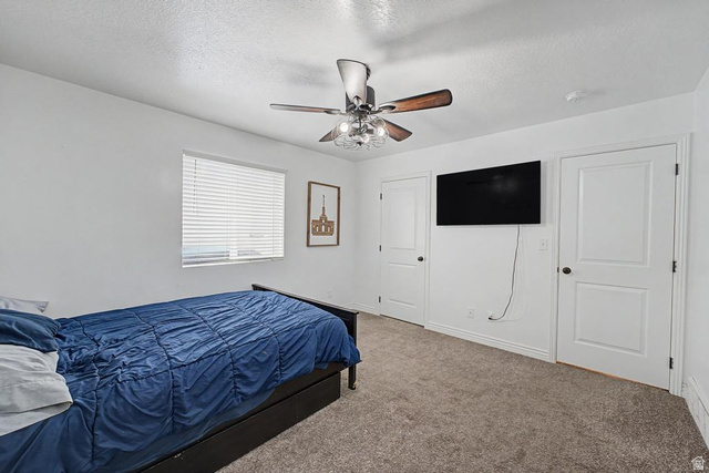 1692 South Windemere Road Santaquin, UT 84655 - Photo 8 of 23 Carpeted room featuring a ceiling fan with light fixture, window with horizontal blinds, and two panel doors
