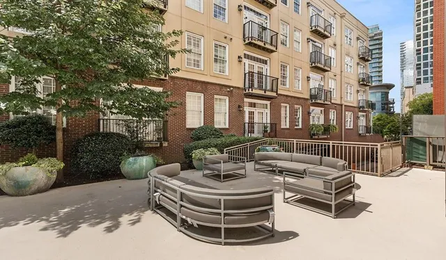 a view of a patio with a table and chairs