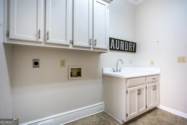 a view of a livingroom with wooden floor and a ceiling fan