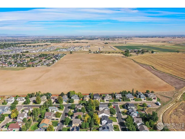 an aerial view of residential building and ocean