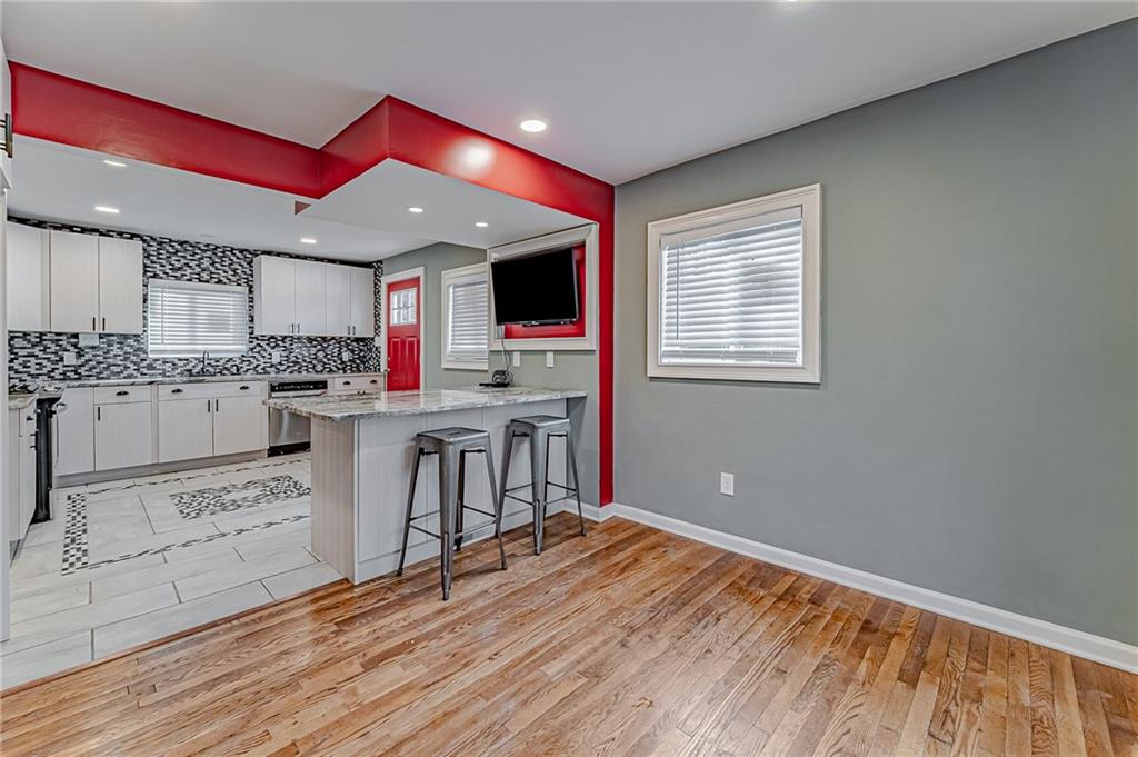 414 Hochberg Road Pittsburgh, PA 15235 - Photo 17 of 23 a kitchen with stainless steel appliances granite countertop a stove and cabinets