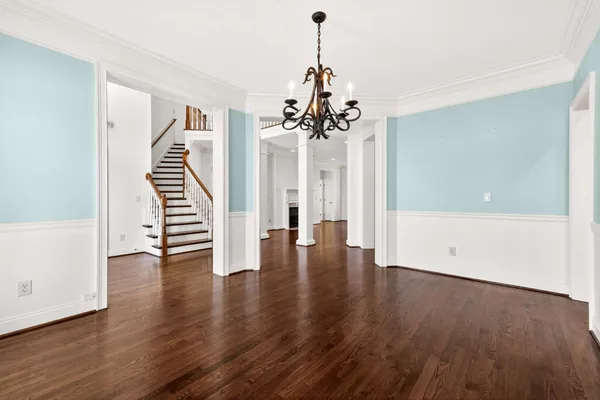 a view of an entryway with wooden floor