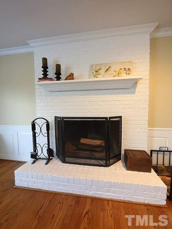 2501 Bredon Court Raleigh, NC 27613 - Photo 11 of 25 a living room with furniture and a fireplace