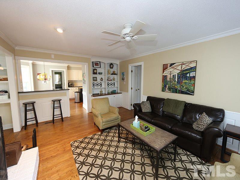 2501 Bredon Court Raleigh, NC 27613 - Photo 12 of 25 a living room with furniture and a view of kitchen