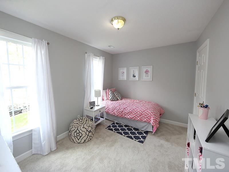 2501 Bredon Court Raleigh, NC 27613 - Photo 20 of 25 a bedroom with a bed and a window