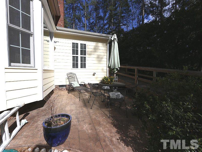 2501 Bredon Court Raleigh, NC 27613 - Photo 22 of 25 a view of a patio with table and chairs and potted plants