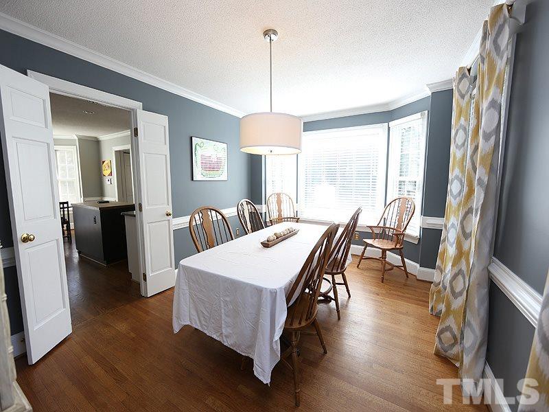 2501 Bredon Court Raleigh, NC 27613 - Photo 5 of 25 a view of a a dining room with furniture window and wooden floor