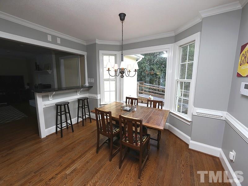2501 Bredon Court Raleigh, NC 27613 - Photo 9 of 25 a view of a dining room with furniture window and wooden floor