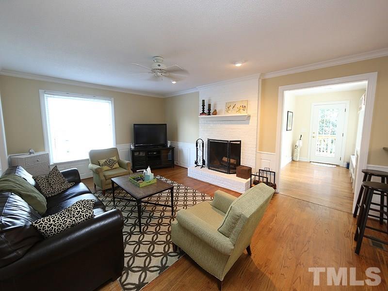 2501 Bredon Court Raleigh, NC 27613 - Photo 10 of 25 a living room with furniture and a flat screen tv