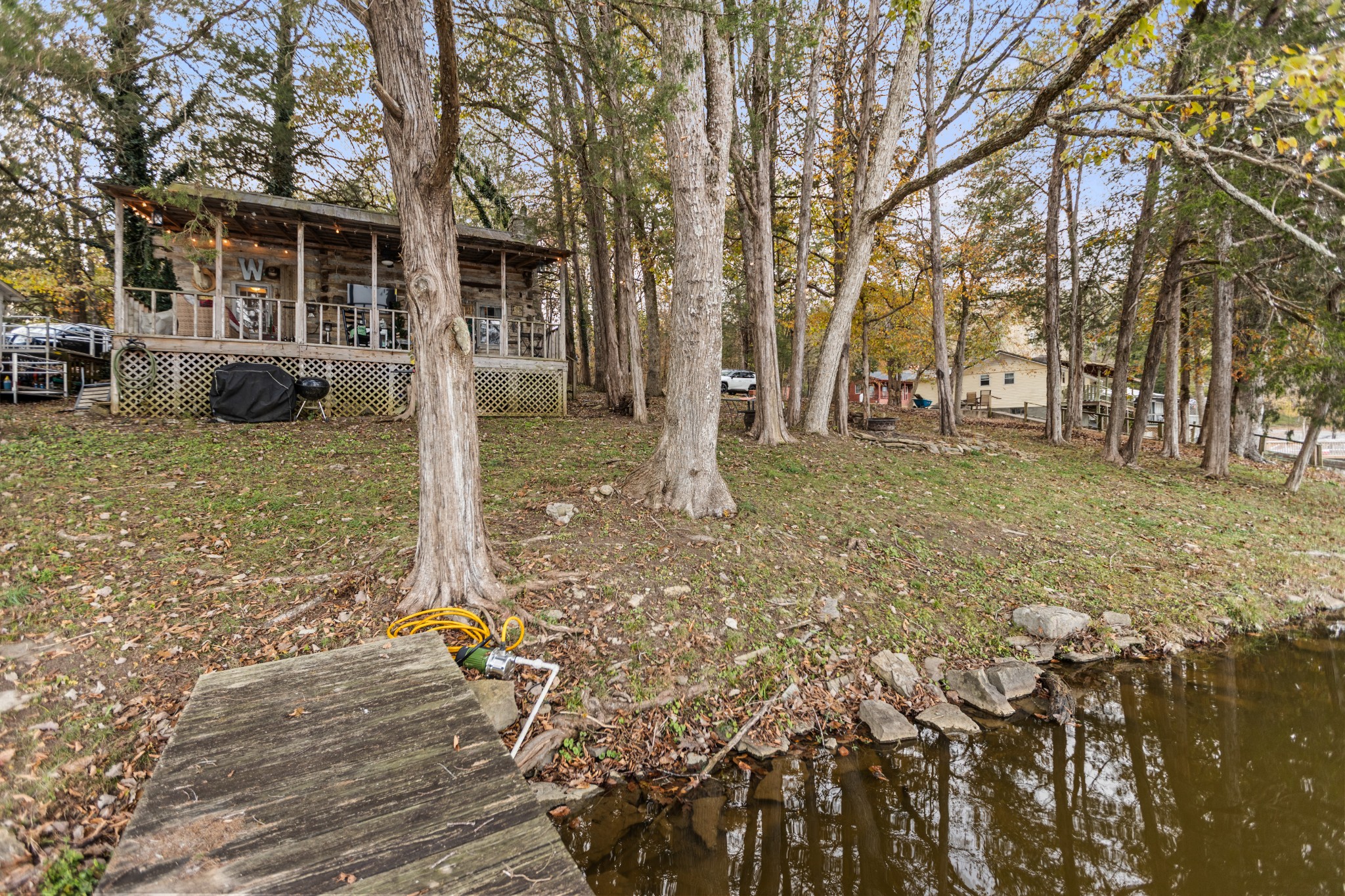 116 Lincoln Lake Road Kelso, TN 37348 - Photo 14 of 46 a backyard of a house with table and chairs