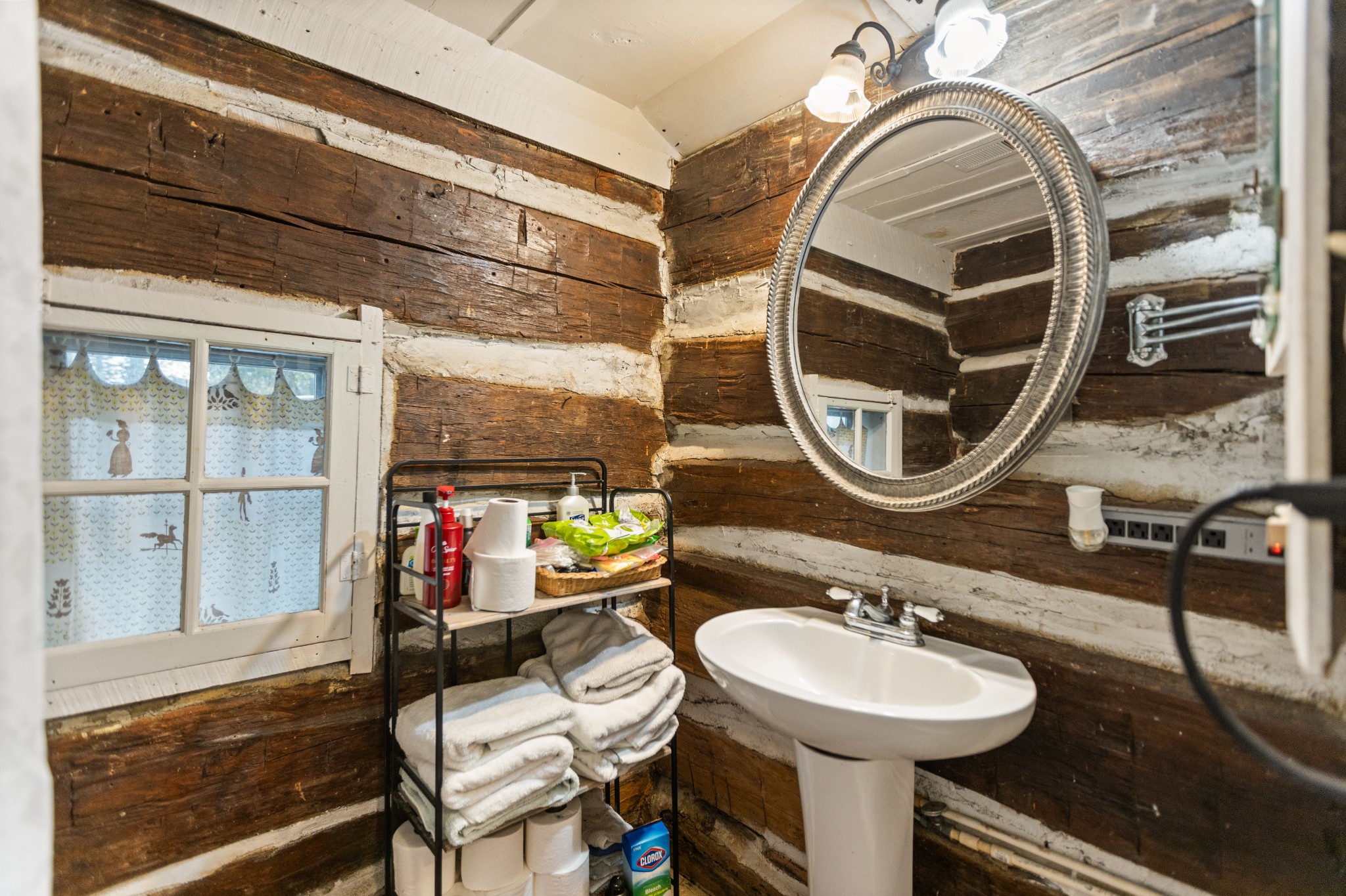 116 Lincoln Lake Road Kelso, TN 37348 - Photo 30 of 46 a bathroom with a sink and a mirror