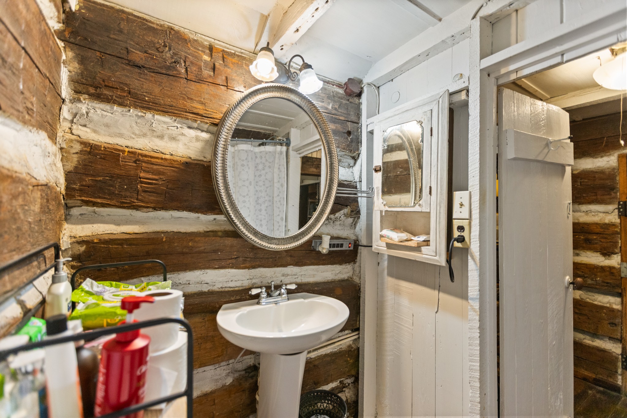 116 Lincoln Lake Road Kelso, TN 37348 - Photo 31 of 46 a bathroom with a sink and a mirror