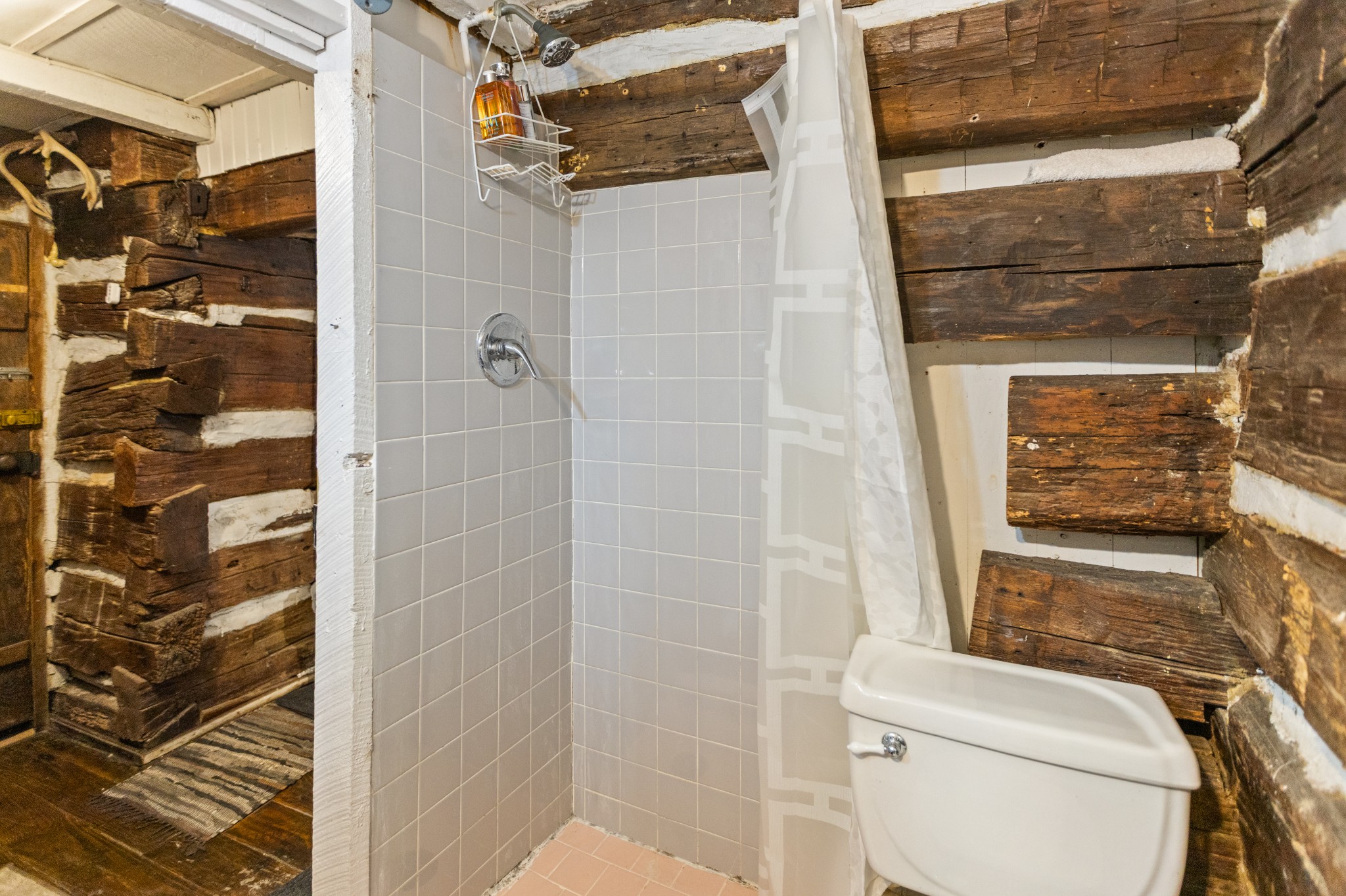 116 Lincoln Lake Road Kelso, TN 37348 - Photo 32 of 46 a bathroom with a toilet and a shower