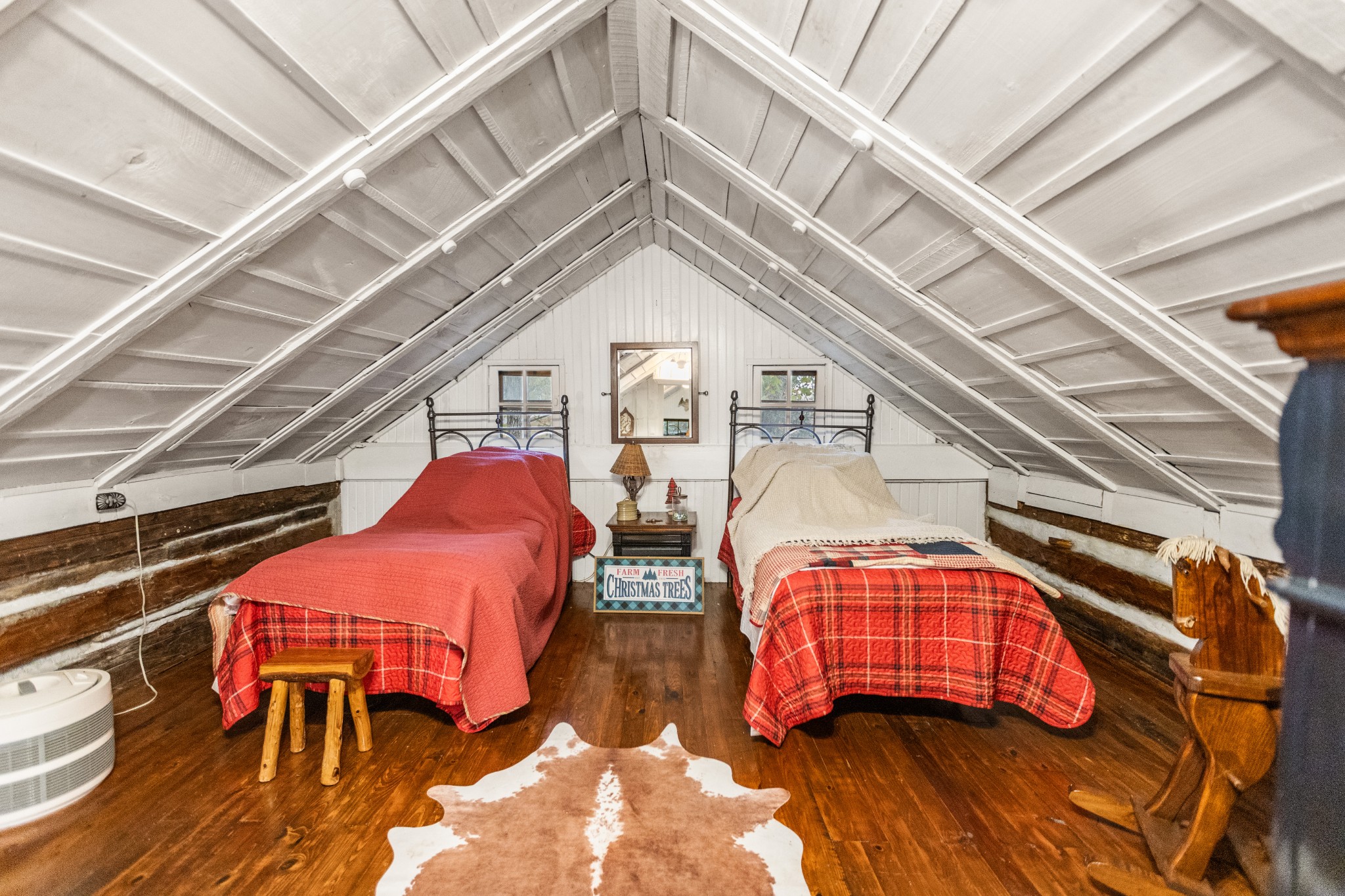116 Lincoln Lake Road Kelso, TN 37348 - Photo 34 of 46 a bedroom with two beds and a chandelier