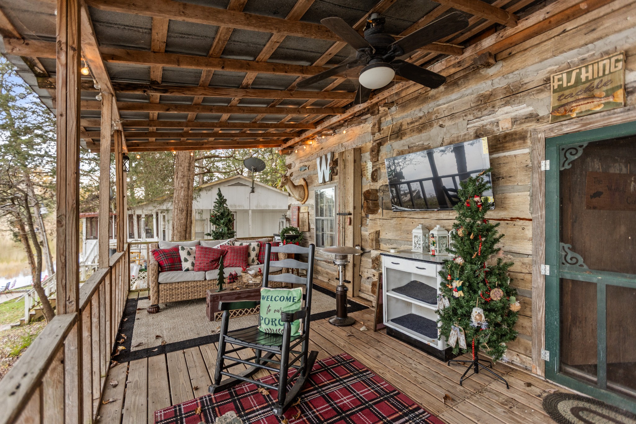 116 Lincoln Lake Road Kelso, TN 37348 - Photo 8 of 46 a view of a porch with furniture and a grill