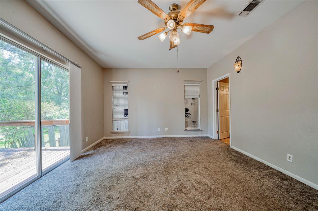 1006 Rikkity Lane Mount Pleasant, TX 75455 - Photo 17 of 39 an empty room with chandelier fan