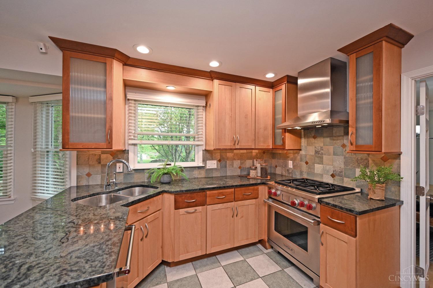 3263 Cooper Road Evendale, OH 45241 - Photo 11 of 49 Custom designed by Auer Kitchens, the timeless finishes are warm but very functional for the Chef in the house!