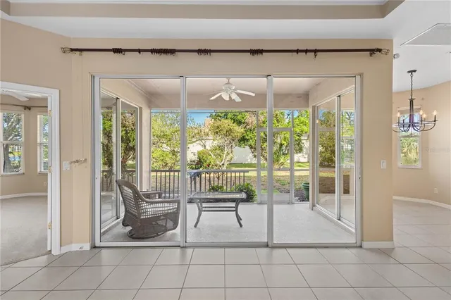 a living room with a large window and table