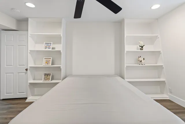 a bedroom with a bed and a cabinets