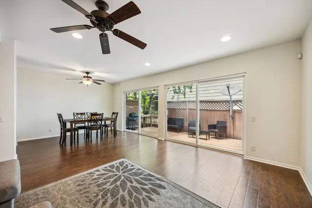 wooden floor with chandelier and outdoor view