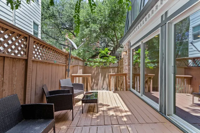 a view of backyard with a table and chairs