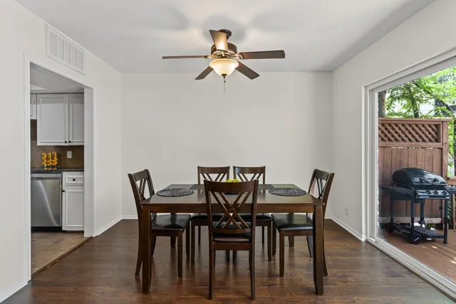 a view of a dining room with furniture and window