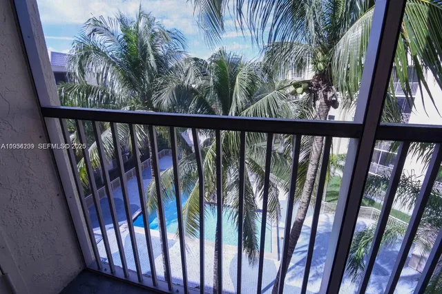 a view of a small yard from a balcony