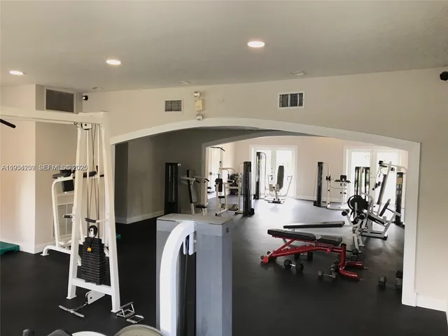 a view of a livingroom with furniture and kitchen