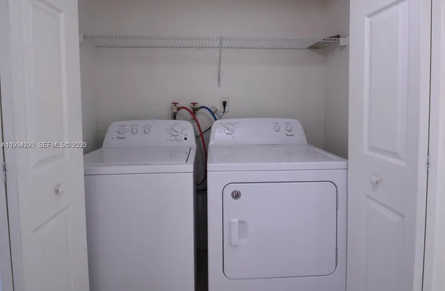 a utility room with dryer and washer