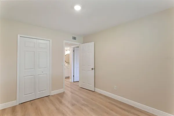 a view of a livingroom with furniture and floor to ceiling window