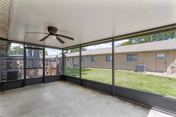a backyard of a house with wooden floor
