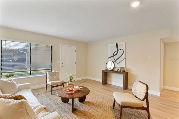 a view of a dining room with furniture and wooden floor