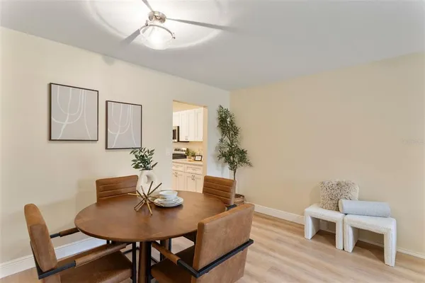 a kitchen with granite countertop a sink a stove and cabinets