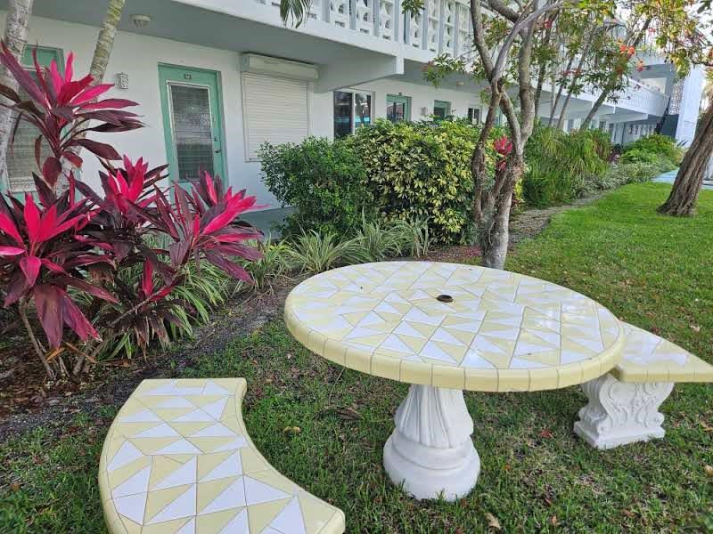 2151 Northeast 42nd Court, Unit 230 Lighthouse Point, FL 33064 - Photo 11 of 40 a view of a water fountain in front of a house
