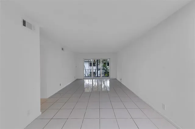 a view of an empty room and window