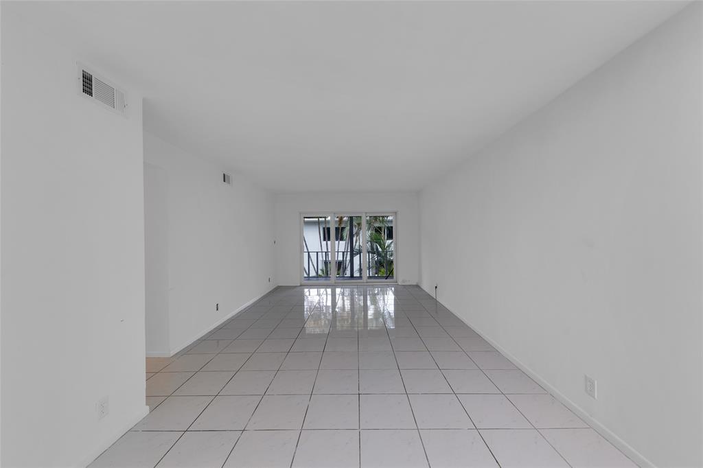 2151 Northeast 42nd Court, Unit 230 Lighthouse Point, FL 33064 - Photo 13 of 40 a view of an empty room and window