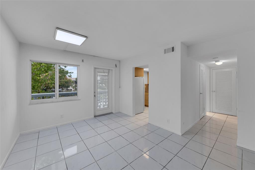 2151 Northeast 42nd Court, Unit 230 Lighthouse Point, FL 33064 - Photo 15 of 40 a view of an empty room and window