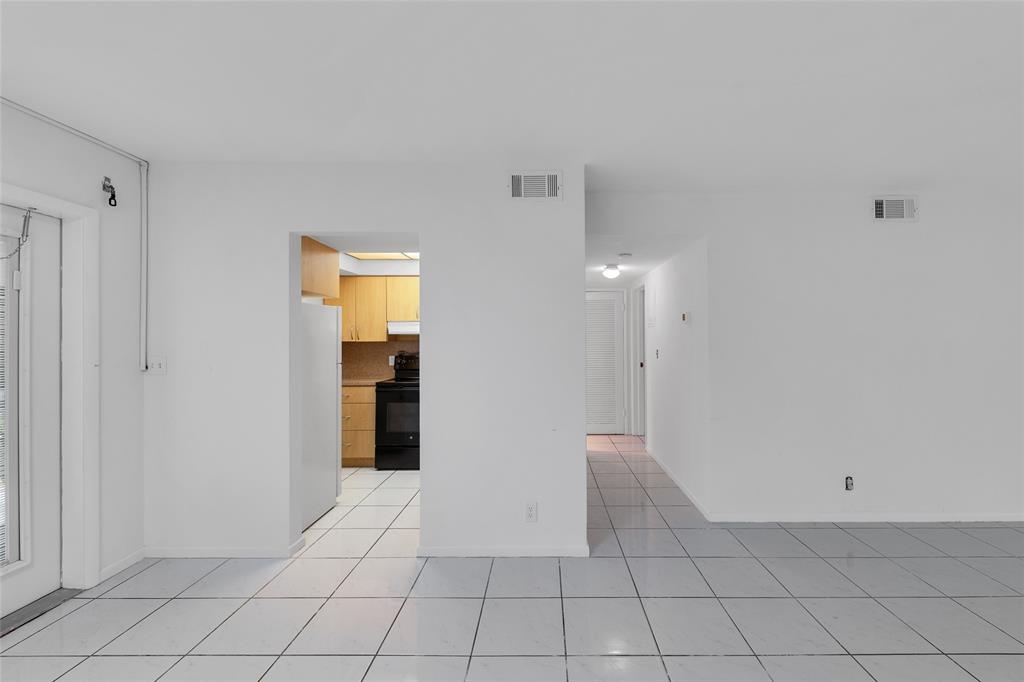 2151 Northeast 42nd Court, Unit 230 Lighthouse Point, FL 33064 - Photo 17 of 40 a view of an empty room with closet area