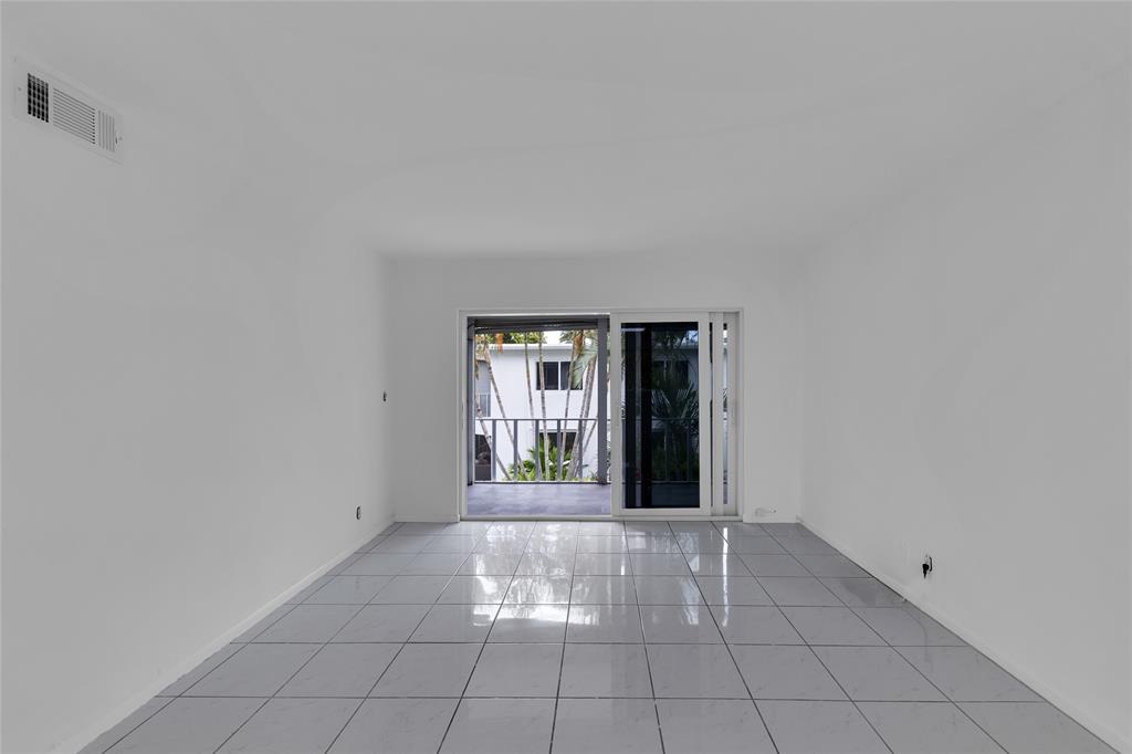 2151 Northeast 42nd Court, Unit 230 Lighthouse Point, FL 33064 - Photo 19 of 40 a view of an empty room with windows