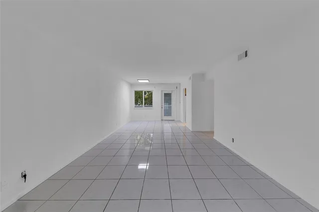 a kitchen with a refrigerator and a stove
