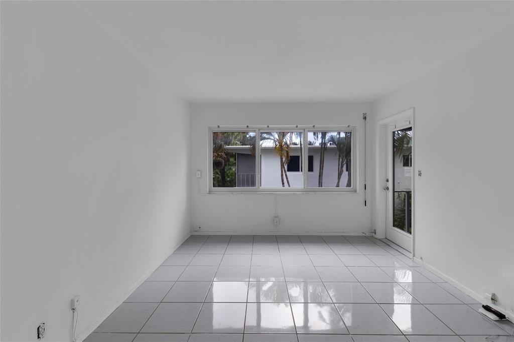 2151 Northeast 42nd Court, Unit 230 Lighthouse Point, FL 33064 - Photo 26 of 40 a view of an empty room with window