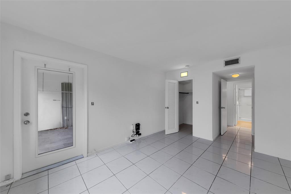 2151 Northeast 42nd Court, Unit 230 Lighthouse Point, FL 33064 - Photo 28 of 40 a view of an empty room