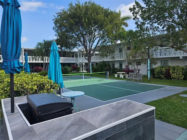 a view of a bench in front of house