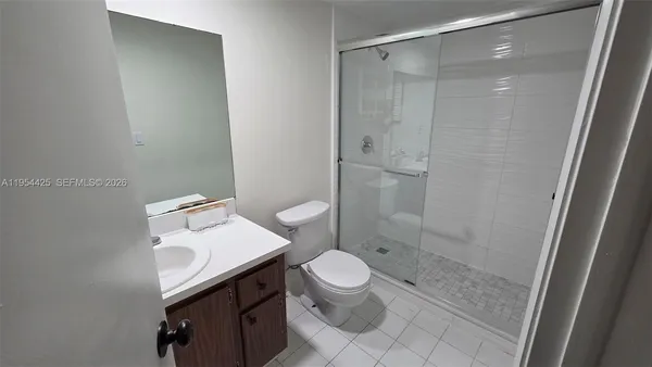 a view of backyard of a house with a garden and swimming pool