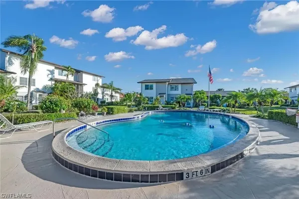 a view of a swimming pool with a patio
