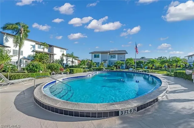 a view of a swimming pool with a patio