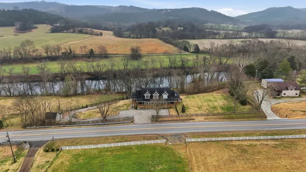 a living room with fireplace furniture and a flat screen tv