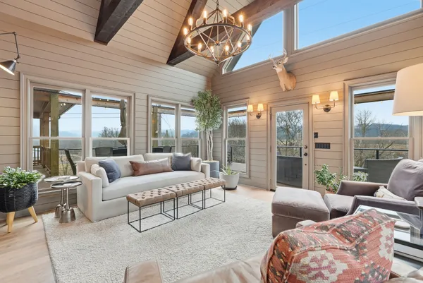 a spacious bedroom with a bed and a window